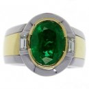 A Contemporary Oval Emerald and Diamond single stone ring. A Contemporary Oval Emerald and Diamond single stone ring.
