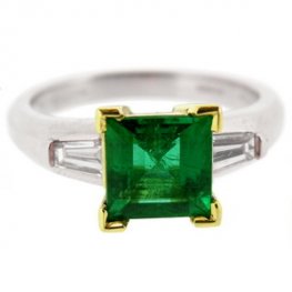 Square Emerald solitaire ring with baguette diamond shoulders.