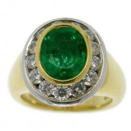 Bold Oval Emerald and Diamond Cluster Ring. 18carat Gold