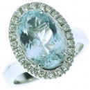 A Stunning Oval Aquamarine and Diamond Cluster Ring. 18k Gold. A Stunning Oval Aquamarine and Diamond Cluster Ring. 18k Gold.