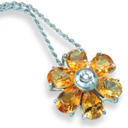 An Oval Citrine and Diamond Flower Pendant. 18ct White Gold.