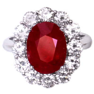 A White Gold Oval Ruby and Diamond Cluster Ring. 18kt.