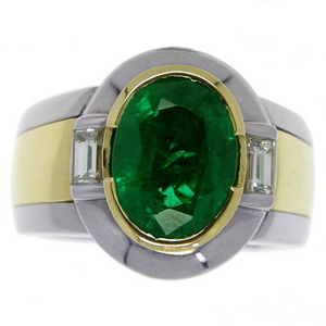 A Contemporary Oval Emerald and Diamond single stone ring. - Click Image to Close