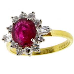 Oval Ruby and Diamond Cluster Ring. 18 karat Gold.