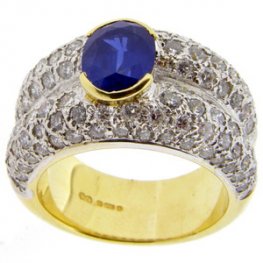 Contemporary Oval Sapphire and Pave Diamond Ring.