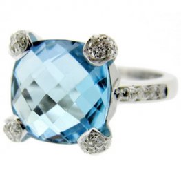 18 carat gold. A Blue Topaz and Diamond Ring.