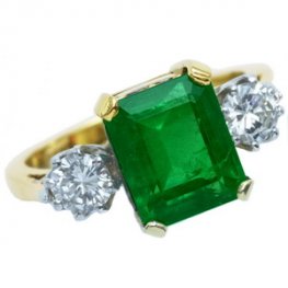 Diamond & Emerald Three Stone Ring. A fine Emerald cut Emerald.