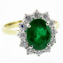 18k gold Columbian Emerald Ring set with Diamonds as a Cluster.