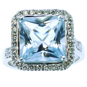 A White Gold Square Aquamarine and Diamond Cluster Ring.