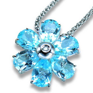 An 18K White Gold Blue Topaz and Diamond Flower Pendant. - Click Image to Close